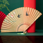 Silk folding fan with bamboo ribs and floral embroidery