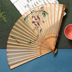 Silk folding fan with bamboo ribs and floral embroidery