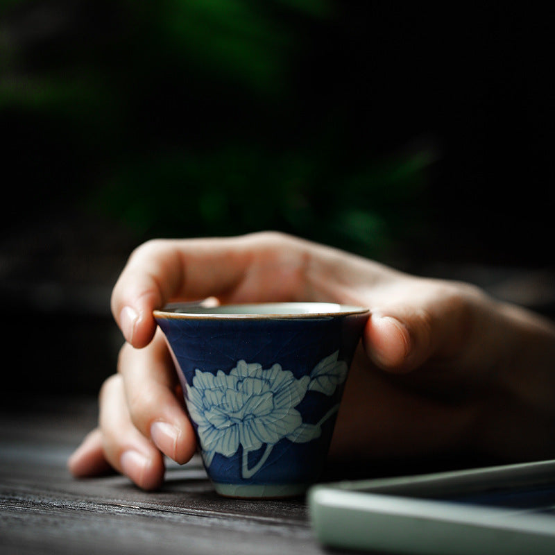 Hand-painted ceramic teapot with blue glaze finish